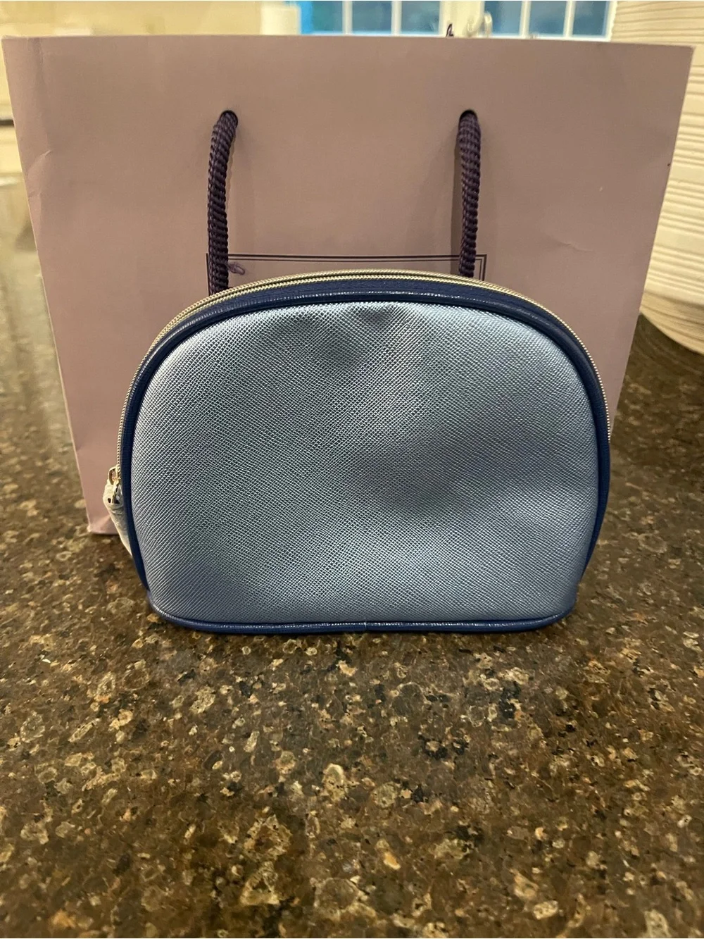 La Mer Light Blue Cosmetic Pouch with Bergdorf Goodman shopping bag